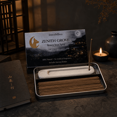 Incense sticks in a holder with packaging labeled 'Zenith Grove' on a dark surface.
