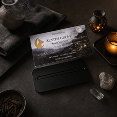 Incense burner with 'Zenith Grove' packaging on a dark surface with candles and crystals.