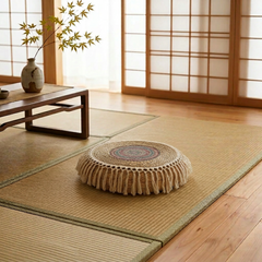 Japanese-style room with tatami mats, wooden floor, and a decorative pillow.
