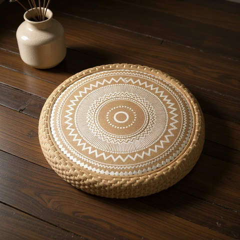Round woven mat with a geometric pattern on a wooden floor